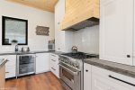 Amazing kitchen with 6 burner gas grill and wine cooler